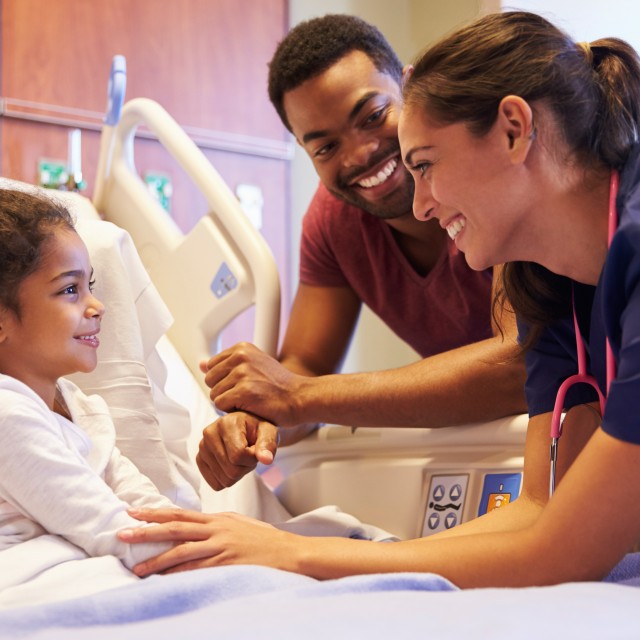 Pediatric patient with her father and doctor