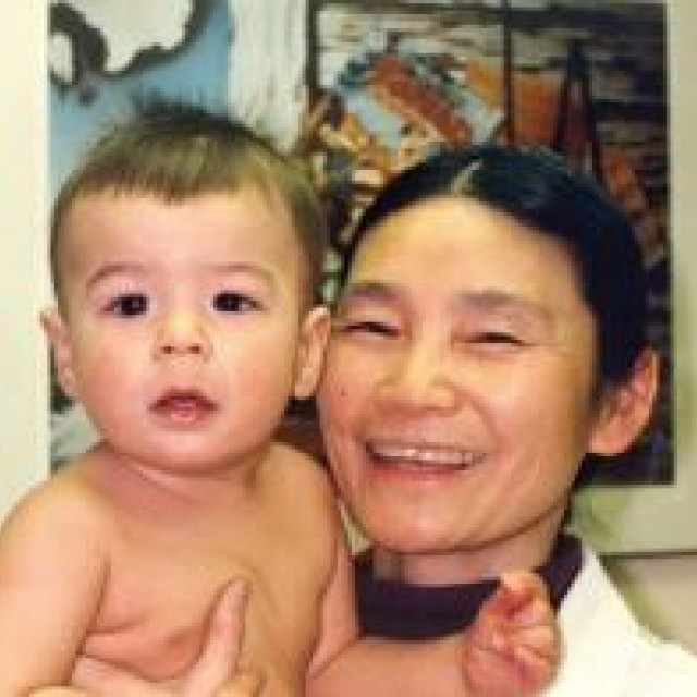 A woman holding a baby