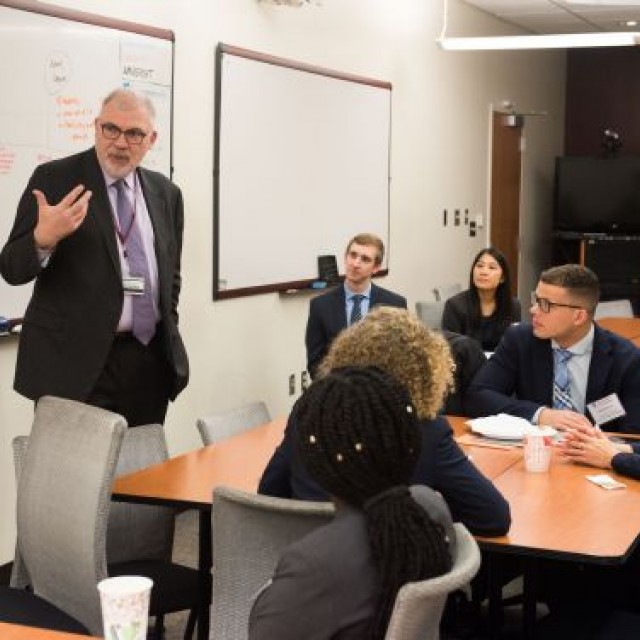 John Cunningham, MD, giving a presentation 