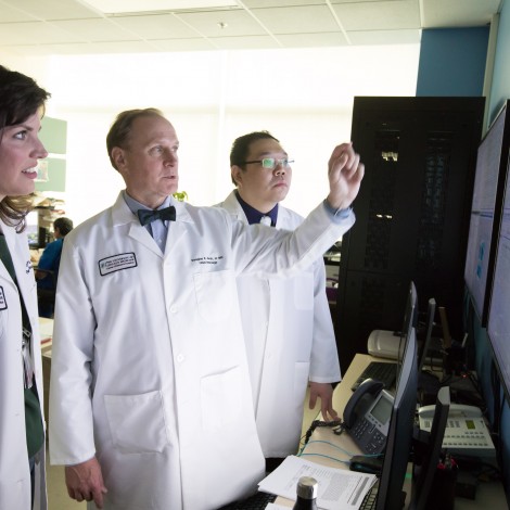 Douglas R. Nordli, Jr., MD talking about a scan with other doctors